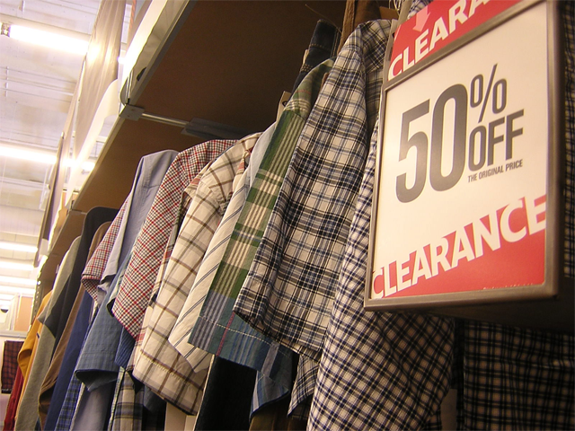 A 50% off sign in a clothing store