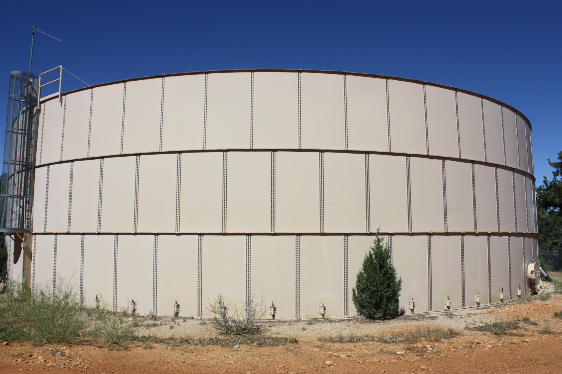 A large circular tank with a ladder on the side.
