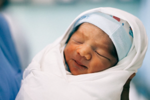 A swaddled newborn.