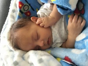 An infant sleeping.