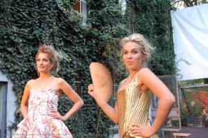 Two girls looking proud in their fancy dresses.