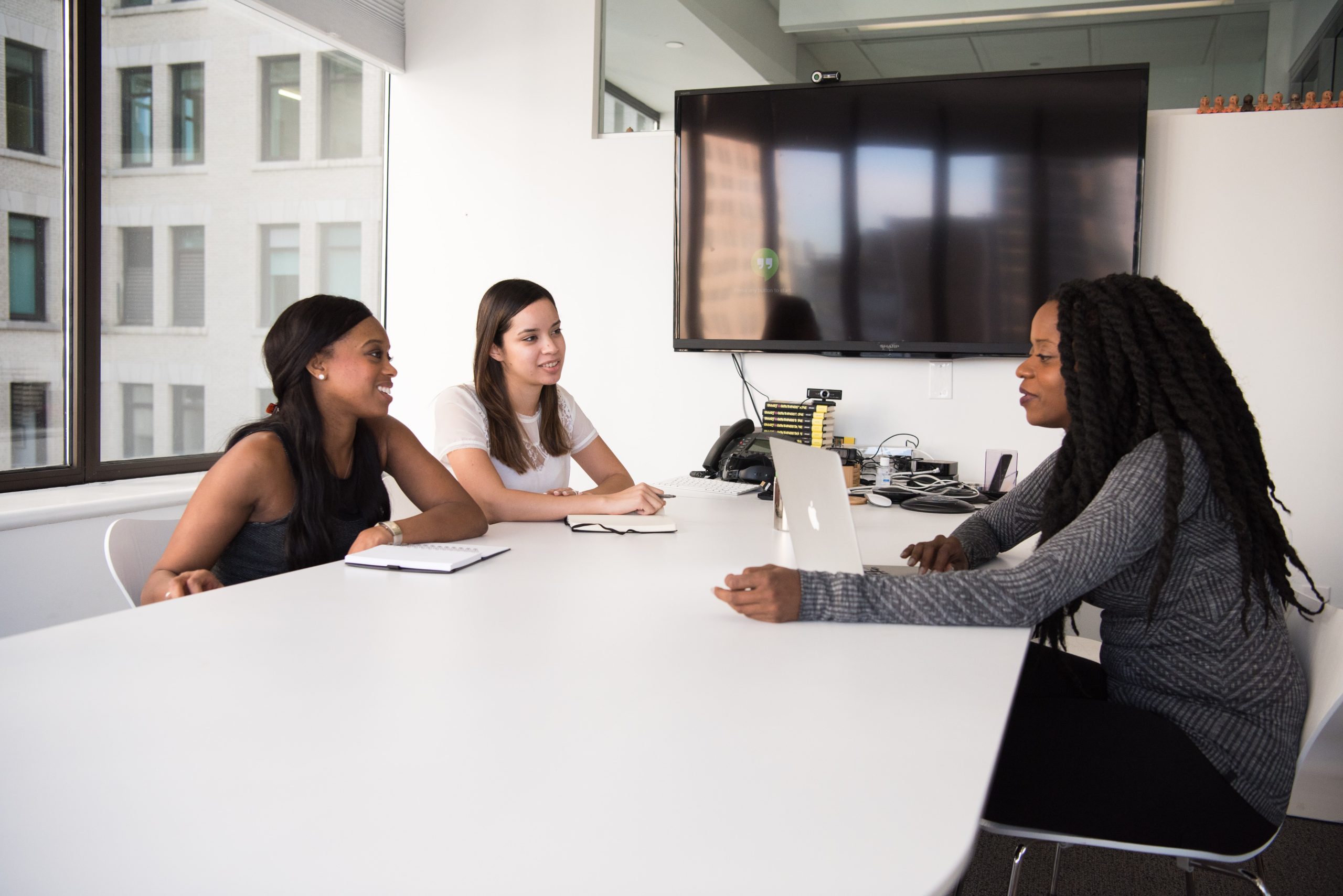 three women working around a table