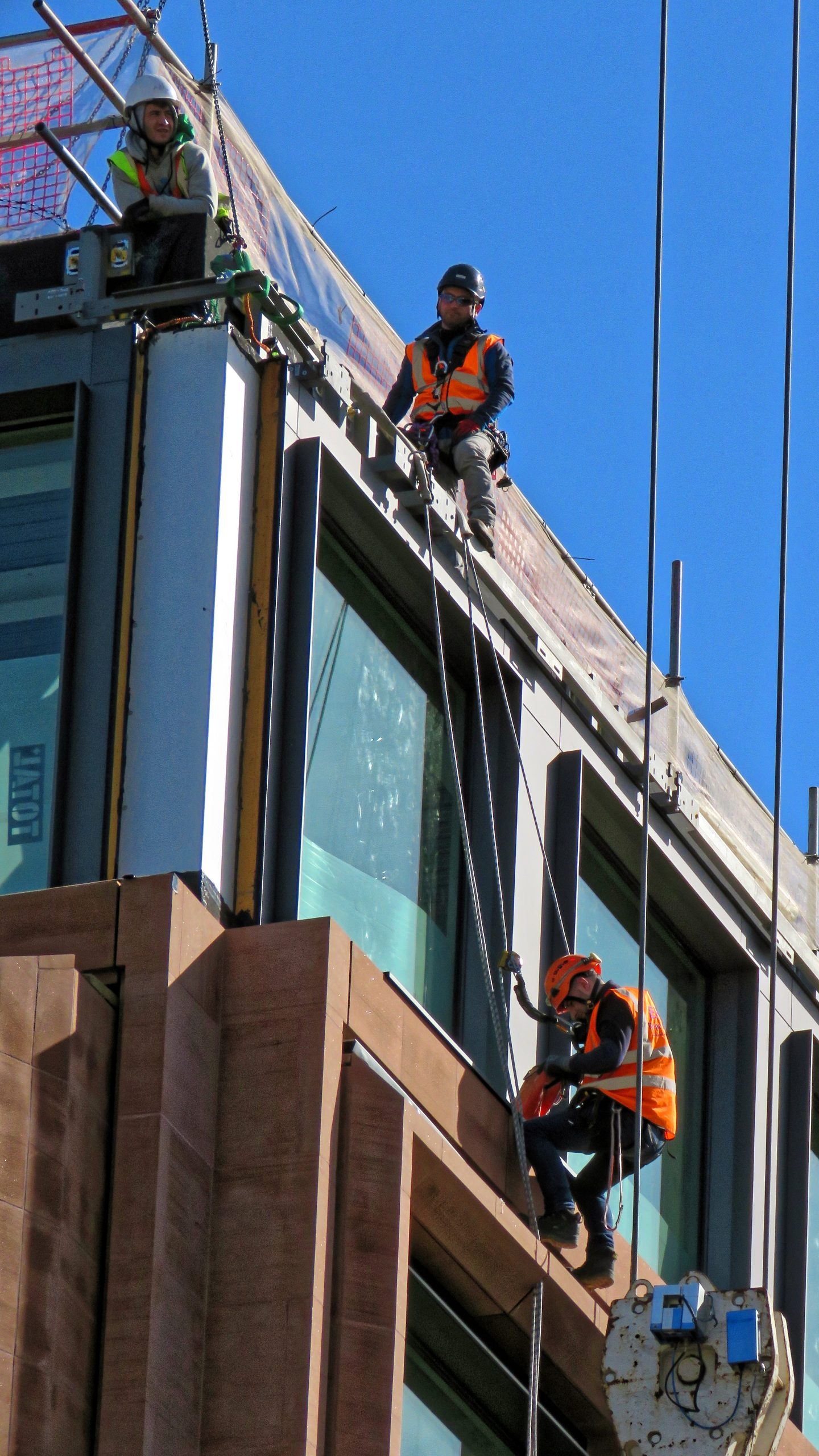 Construction workers on Distaff Lane building site, City of London England