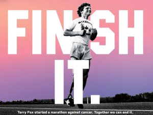 Terry Fox mid-run, captured against a sunset with the words "Finish It", symbolizing his determination and the legacy of the Marathon of Hope.