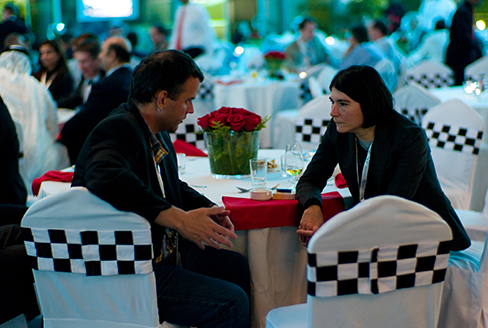 A photograph shows two people making eye contact during a conversation.