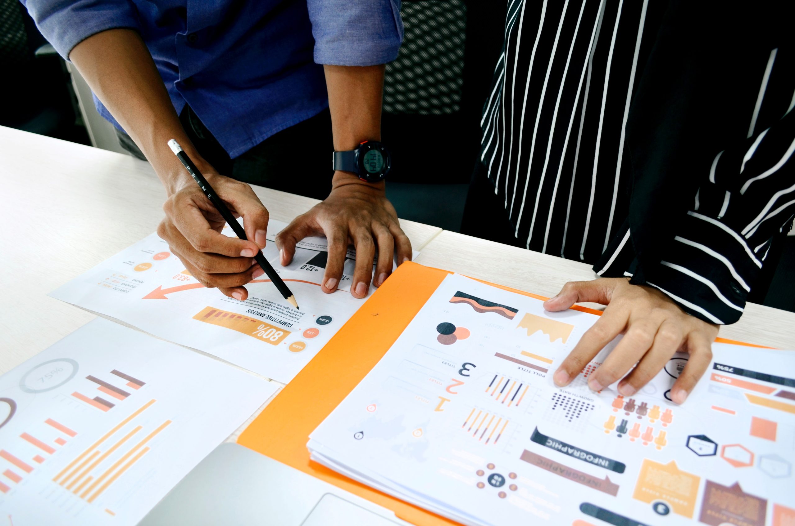 Two people looking at data visualizations